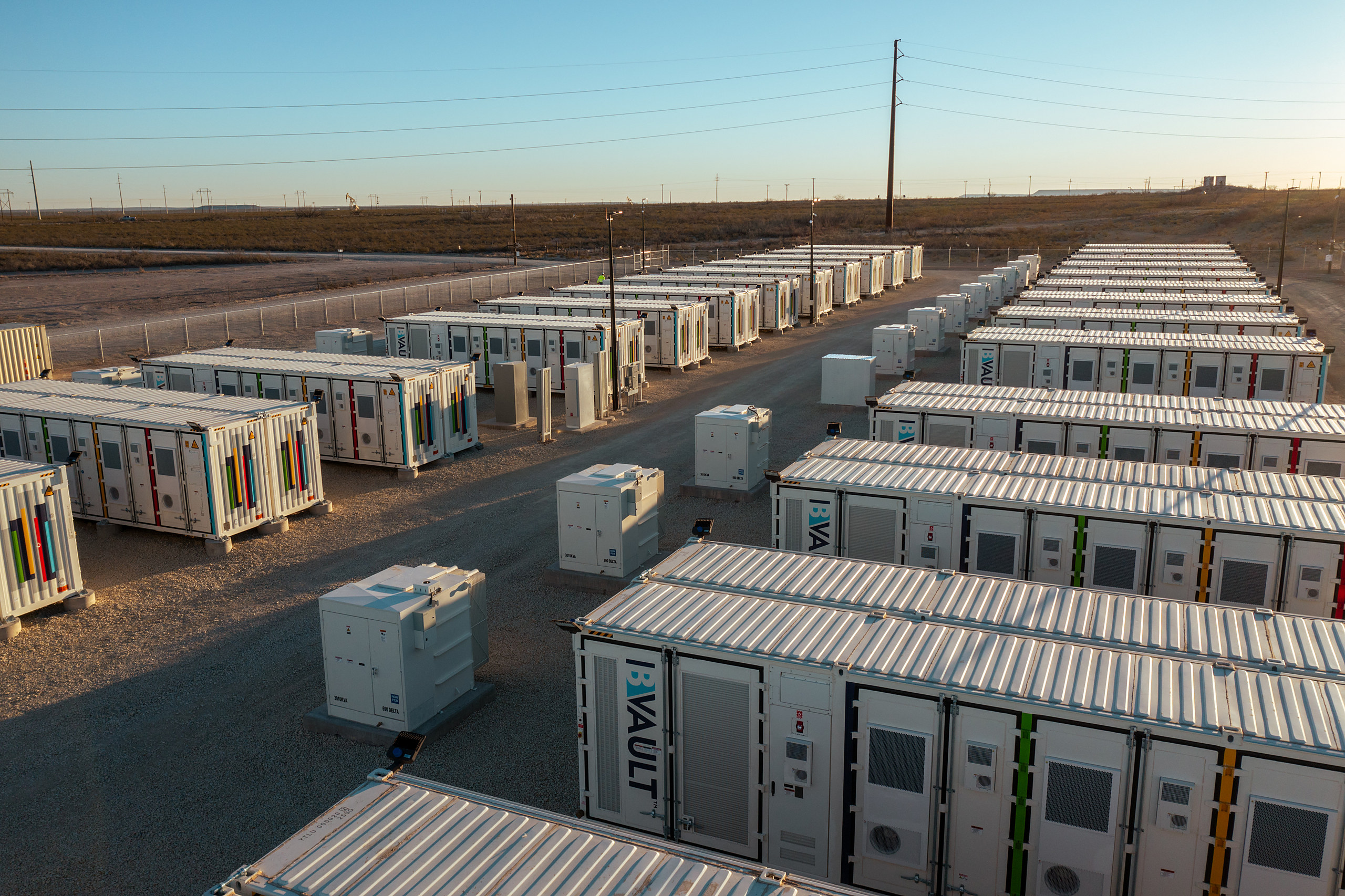 Power-ready land with storage containers at dusk