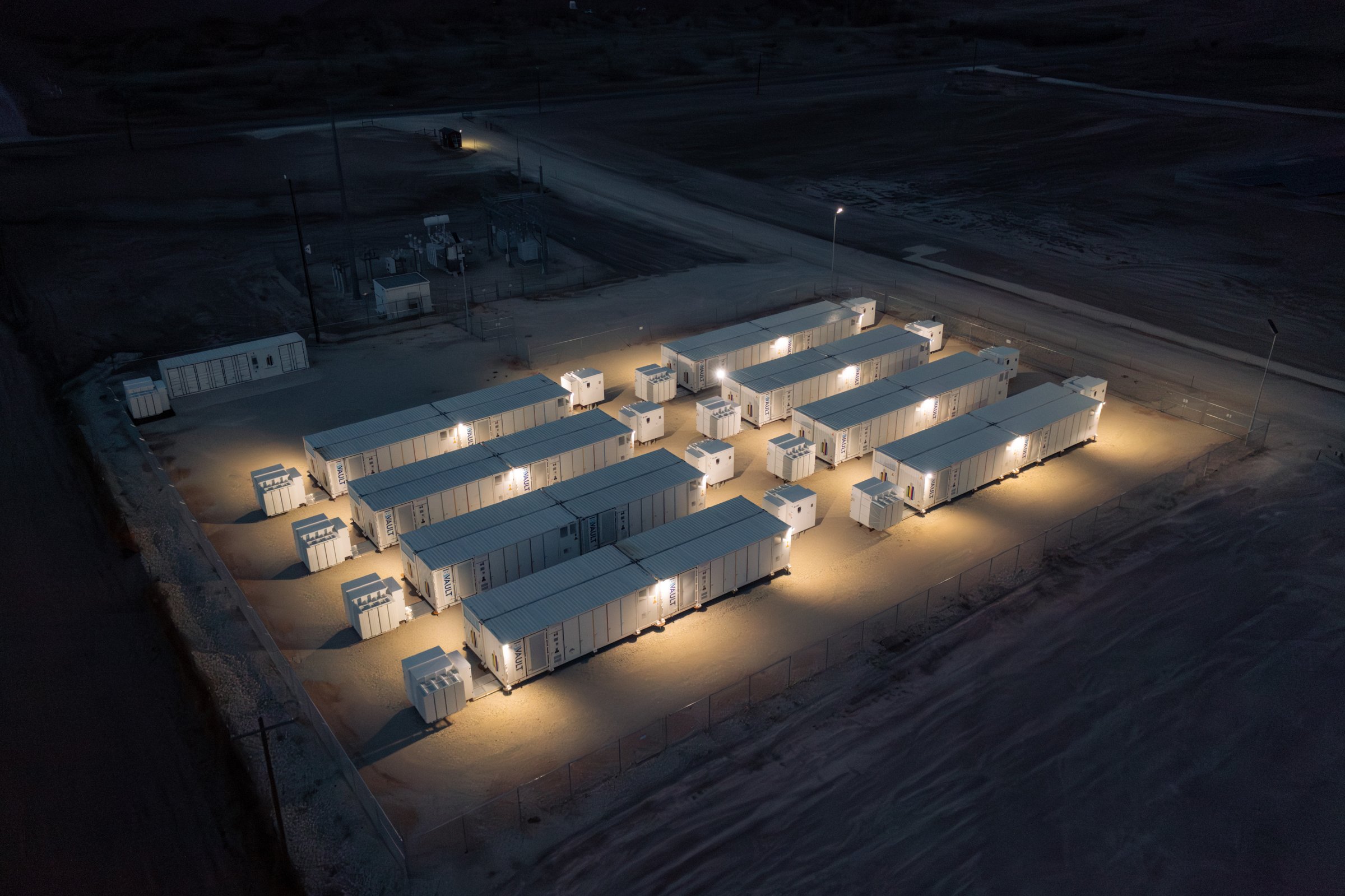 Night aerial of an illuminated battery storage site